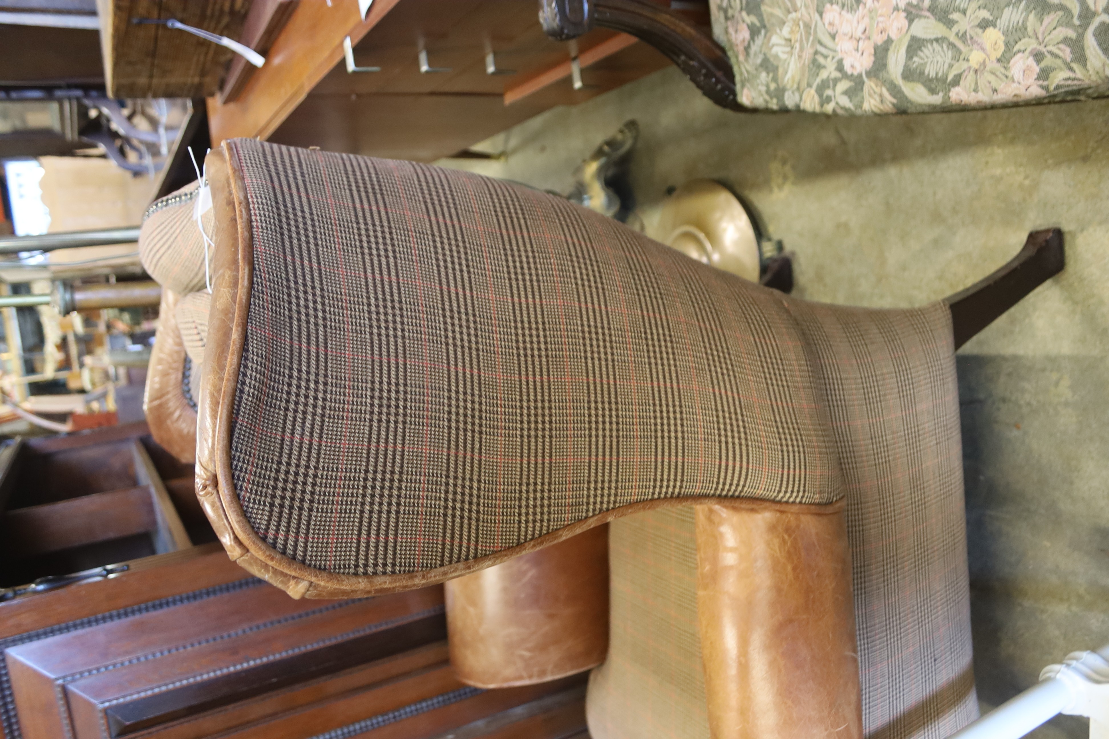A Victorian style tweed and tan leather wing armchair, width 80cm, depth 84cm, height 98cm